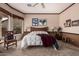 Spacious carpeted bedroom featuring a ceiling fan and decorative wood trim accents at 8307 S Desert Preserve Ct, Gold Canyon, AZ 85118
