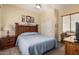 Bedroom featuring carpet floors, ceiling fan, wood furniture and light blue bedspread at 8307 S Desert Preserve Ct, Gold Canyon, AZ 85118