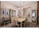 Elegant dining room features a decorative chandelier and neutral decor at 8307 S Desert Preserve Ct, Gold Canyon, AZ 85118