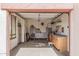 Organized garage space with storage cabinets, workbench, and natural light at 8307 S Desert Preserve Ct, Gold Canyon, AZ 85118