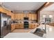 Bright kitchen featuring stainless appliances, wooden cabinetry and a large island with sink at 8307 S Desert Preserve Ct, Gold Canyon, AZ 85118