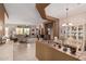 Spacious open floor plan with tile leading to carpeted living and dining areas at 8307 S Desert Preserve Ct, Gold Canyon, AZ 85118