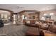 Open-concept living space with a cozy living room adjacent to the kitchen at 8307 S Desert Preserve Ct, Gold Canyon, AZ 85118
