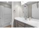 Neutral bathroom features a single sink, grey vanity, and shower-tub combo at 8340 E Mcdonald Dr # 1016, Scottsdale, AZ 85250