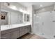 Bathroom showcasing dual sinks, gray cabinets, neutral paint, and walk-in shower at 8340 E Mcdonald Dr # 1016, Scottsdale, AZ 85250