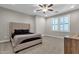 Neutral bedroom featuring carpet, shutters, a ceiling fan, and modern furniture at 8340 E Mcdonald Dr # 1016, Scottsdale, AZ 85250