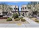 Contemporary home exteriors with desert landscaping, trees, and pedestrian walkway at 8340 E Mcdonald Dr # 1016, Scottsdale, AZ 85250