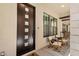 Stylish front door with glass accents, seating area, and view of interior space at 8340 E Mcdonald Dr # 1016, Scottsdale, AZ 85250