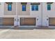 Modern townhome garages with contemporary doors and unit numbers at 8340 E Mcdonald Dr # 1016, Scottsdale, AZ 85250