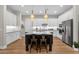 Modern kitchen featuring a large island, stainless steel appliances, and custom white cabinetry at 8340 E Mcdonald Dr # 1016, Scottsdale, AZ 85250