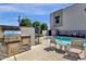 Community pool area with a barbecue and outdoor seating at 8340 E Mcdonald Dr # 1016, Scottsdale, AZ 85250