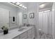 Well-lit bathroom with a large mirror, vanity, and a shower-tub combination at 9035 E Lupine Ave, Scottsdale, AZ 85260