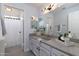 Bright bathroom with updated vanity, mirror, contemporary lighting, and shower-tub combination at 9035 E Lupine Ave, Scottsdale, AZ 85260