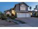 Charming two-story home boasts a three-car garage, desert landscaping, and eye-catching architectural details at 9035 E Lupine Ave, Scottsdale, AZ 85260