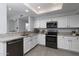 Well-lit kitchen boasts granite countertops, stainless appliances, and a seamless flow to adjacent rooms at 9035 E Lupine Ave, Scottsdale, AZ 85260