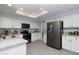 Bright kitchen featuring granite countertops, stainless steel appliances, and white cabinetry at 9035 E Lupine Ave, Scottsdale, AZ 85260