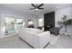 Bright living room with a modern fireplace, comfortable seating, and sliding doors to a private pool at 9035 E Lupine Ave, Scottsdale, AZ 85260