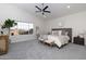 Spacious main bedroom with high ceilings, large window, and comfortable seating at 9035 E Lupine Ave, Scottsdale, AZ 85260