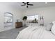 Airy main bedroom with high ceilings, large window, and access to the en-suite bathroom at 9035 E Lupine Ave, Scottsdale, AZ 85260