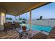 Inviting covered patio with a view of the sparkling pool and slide, perfect for outdoor entertaining at 9035 E Lupine Ave, Scottsdale, AZ 85260