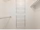 Walk-in closet featuring ample shelving for storage solutions at 10619 W Highwood Ln, Sun City, AZ 85373