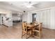 Cozy dining area featuring a ceiling fan, sliding glass door, and neutral colors at 10619 W Highwood Ln, Sun City, AZ 85373