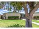 Charming single-story home with a lush green lawn and mature tree in a tranquil setting at 10619 W Highwood Ln, Sun City, AZ 85373