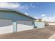 Exterior view of two-car garage with white doors and a driveway at 10619 W Highwood Ln, Sun City, AZ 85373