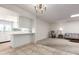 Open-concept living space with a breakfast bar connecting the kitchen, perfect for entertaining at 10619 W Highwood Ln, Sun City, AZ 85373