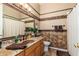 Charming bathroom features granite counters, decorative mosaic tile, and neutral walls at 1074 E Carla Vista Ct, Gilbert, AZ 85295