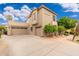 Spacious home featuring a three-car garage and well-maintained exterior at 1074 E Carla Vista Ct, Gilbert, AZ 85295