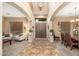 Grand foyer with soaring ceilings, elegant arched doorways, and stylish tile flooring at 1074 E Carla Vista Ct, Gilbert, AZ 85295