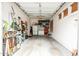 Attached garage with ample storage, pegboard, shelving, and secondary refrigerator at 1074 E Carla Vista Ct, Gilbert, AZ 85295