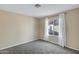 A cozy bedroom featuring neutral walls, plush carpeting, and a window to let in natural light at 10809 N 111Th Pl, Scottsdale, AZ 85259