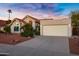 Charming single-Gathering home with a spacious two-car garage and desert landscaping for curb appeal at 10809 N 111Th Pl, Scottsdale, AZ 85259