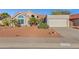 Charming single-story home with a red-tile roof, desert landscaping, and a two-car garage at 10809 N 111Th Pl, Scottsdale, AZ 85259