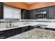 This modern kitchen features granite countertops, stainless steel appliances and designer cabinetry at 10809 N 111Th Pl, Scottsdale, AZ 85259