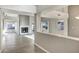 Open-concept living area with a cozy fireplace and light neutral colors at 10809 N 111Th Pl, Scottsdale, AZ 85259