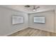 Bedroom with wood floors, ceiling fan, and dual windows to provide great natural light at 110 S 72Nd Way, Mesa, AZ 85208