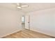 Spacious bedroom showcasing new flooring, a ceiling fan, and natural light from large windows at 110 S 72Nd Way, Mesa, AZ 85208