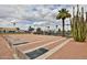 Community recreation area with horseshoe pits, palm trees, and recreational building at 110 S 72Nd Way, Mesa, AZ 85208