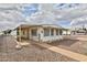 Charming single-story home with a covered porch, fenced yard, and low-maintenance landscaping at 110 S 72Nd Way, Mesa, AZ 85208