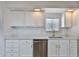 Bright kitchen featuring white cabinets, stainless steel appliances, and a stylish undermount sink at 110 S 72Nd Way, Mesa, AZ 85208