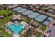 Aerial view of community pool, spa, clubhouse and tennis courts amid desert landscaping at 11736 E Del Timbre Dr, Scottsdale, AZ 85259