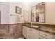 Well-lit bathroom featuring vanity, decorative tiling, large mirror, and walk-in shower at 11736 E Del Timbre Dr, Scottsdale, AZ 85259