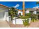 Charming single-story home featuring manicured landscaping and an inviting walkway to the front door at 11736 E Del Timbre Dr, Scottsdale, AZ 85259