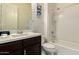 Bright bathroom featuring a single sink vanity and a shower-over-tub at 12031 S 184Th Ave, Goodyear, AZ 85338