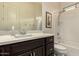 Bright bathroom featuring a single sink vanity and a shower-over-tub at 12031 S 184Th Ave, Goodyear, AZ 85338