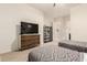 Well-lit bedroom features two twin beds, dresser, and easy hallway access at 12031 S 184Th Ave, Goodyear, AZ 85338