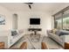 Comfortable living room featuring modern decor and lots of natural light at 12031 S 184Th Ave, Goodyear, AZ 85338
